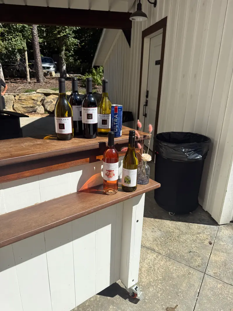 Portable bar stocked with wine and spirits ready for guests