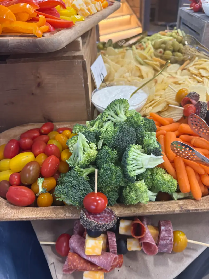 Grazing table of vegetables, fruit and antipasto skewers